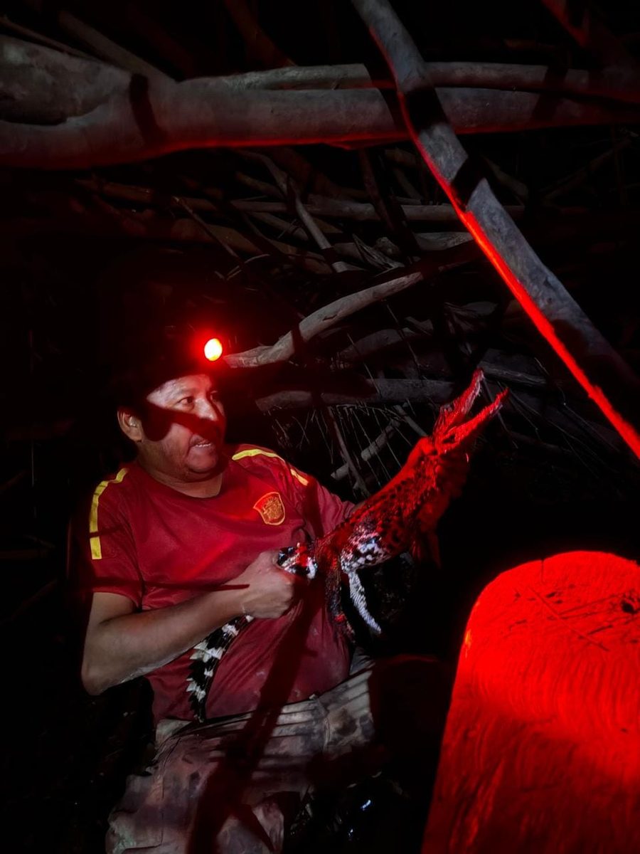 Red headlamp light on the night river